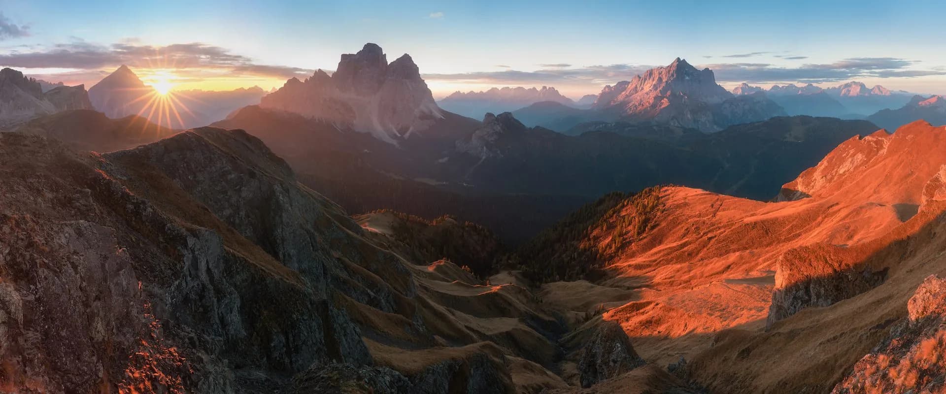 Rugged mountain peaks illuminated by sunrise in Monte Pelmo and Monte Civetta area.